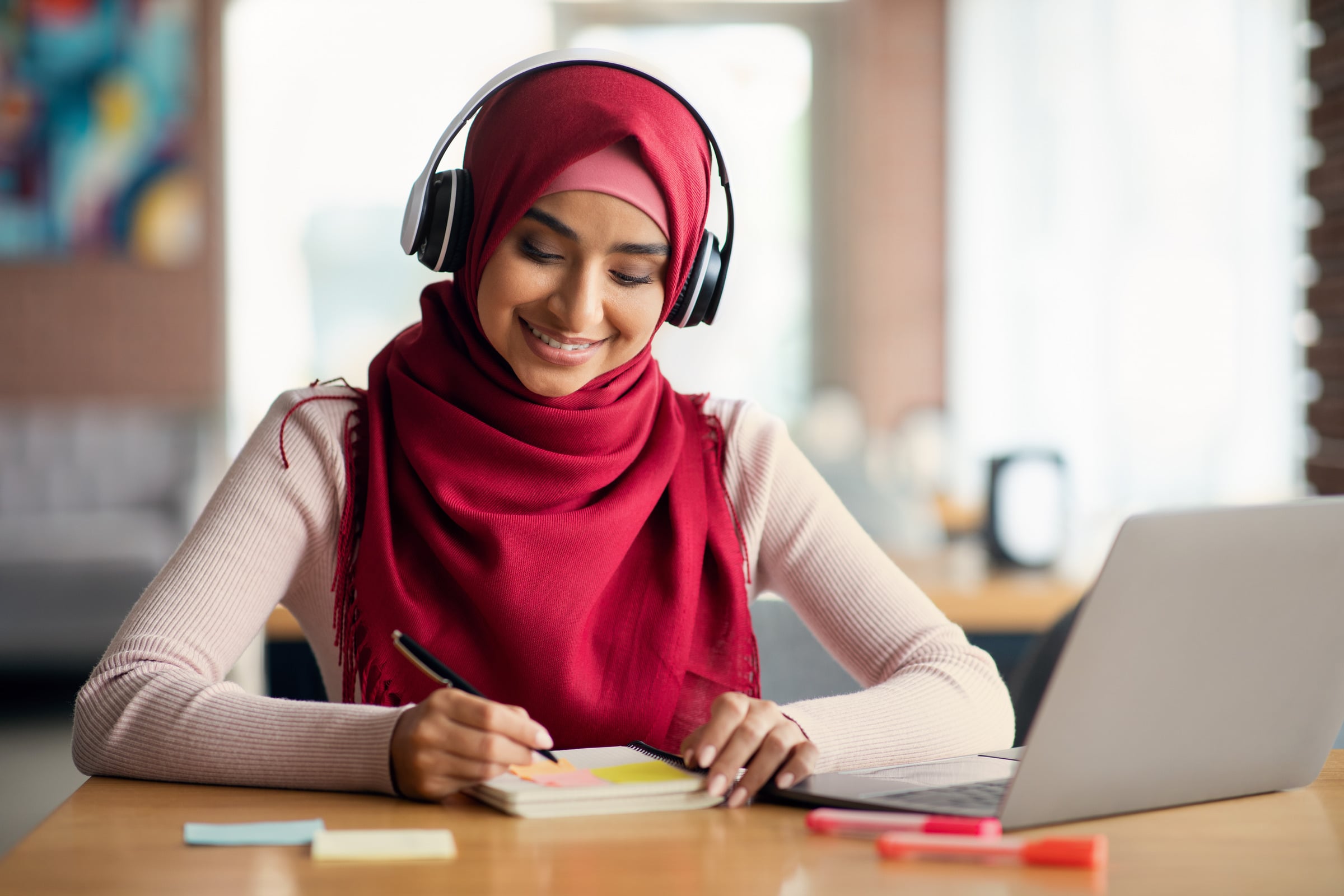 A student working through her notes; illustrative photograph
